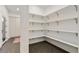 Walk-in pantry featuring open shelving and tiled floors at 2351 N Emerson St, Denver, CO 80205