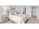 Bedroom features plush carpeting, neutral colors and a walk in closet with ensuite bath at 8711 E Hampden Ave # 22, Denver, CO 80231