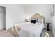 Cozy bedroom featuring a plush bed with decorative pillows and neutral tones at 8711 E Hampden Ave # 22, Denver, CO 80231