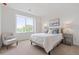 Serene bedroom with a large window and relaxing view, enhanced by stylish furniture at 8711 E Hampden Ave # 22, Denver, CO 80231