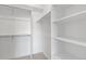 Walk in closet features carpeted floors, shelving and hanging racks at 8711 E Hampden Ave # 22, Denver, CO 80231