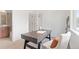 Spacious home office featuring adjacent bath with minimalist furnishings and natural light at 8711 E Hampden Ave # 22, Denver, CO 80231