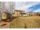 Large, grassy backyard with a spacious home, shed and patio for outdoor enjoyment at 3392 Homestead Dr, Longmont, CO 80504