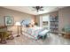 Comfortable bedroom with carpet floors, a ceiling fan, a bright window, and stylish decor at 3392 Homestead Dr, Longmont, CO 80504