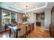 Formal dining area featuring a chandelier, long table, and built-in cabinet at 3392 Homestead Dr, Longmont, CO 80504