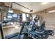 Spacious home gym with a treadmill, elliptical, and other workout equipment at 3392 Homestead Dr, Longmont, CO 80504