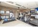 Well-equipped home gym in the garage with various exercise machines and storage solutions at 3392 Homestead Dr, Longmont, CO 80504