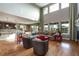 Open-concept living area featuring hardwood floors, high ceilings and fireplace at 3392 Homestead Dr, Longmont, CO 80504