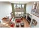Spacious living room boasts hardwood floors, a fireplace, soaring ceilings, and abundant natural light at 3392 Homestead Dr, Longmont, CO 80504