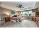 Relaxing main bedroom featuring large windows, neutral tones, ceiling fan, and ample space at 3392 Homestead Dr, Longmont, CO 80504