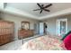 Well-lit main bedroom featuring a ceiling fan, neutral tones, tray ceilings, and lots of room at 3392 Homestead Dr, Longmont, CO 80504