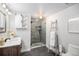This bathroom boasts a tiled walk-in shower and a decorative ladder for hanging towels at 2812 W Davies Dr, Littleton, CO 80120