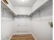 A walk-in closet with hanging rods and shelving offers plenty of room for storage at 2812 W Davies Dr, Littleton, CO 80120