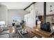 Bright living space featuring open floor plan, wood burning stove, and lots of natural light at 2812 W Davies Dr, Littleton, CO 80120