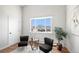 Comfortable living room area with a large window and modern furnishings at 2812 W Davies Dr, Littleton, CO 80120