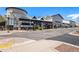 An outdoor shopping center with restaurants and retail stores on a sunny day at 2812 W Davies Dr, Littleton, CO 80120