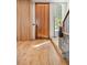 Bright foyer with a hardwood floor, a statement front door, and a staircase with black metal railings at 203 Garfield St, Denver, CO 80206