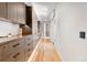 Hallway with custom cabinetry offering ample storage and a sleek, contemporary design with hardwood floors at 203 Garfield St, Denver, CO 80206