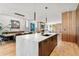 Spacious kitchen featuring an island, seamlessly connected to the living and dining areas at 203 Garfield St, Denver, CO 80206