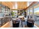 An inviting living room features a stylish bar, bookshelves, comfortable seating, and access to the outdoor patio at 203 Garfield St, Denver, CO 80206
