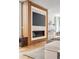 Living room featuring a fireplace, entertainment center, hardwood floors, and bright natural light at 203 Garfield St, Denver, CO 80206