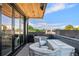 Relaxing outdoor patio features comfortable seating and a stylish outdoor firepit, perfect for entertaining and enjoying the outdoors at 203 Garfield St, Denver, CO 80206