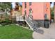 Charming backyard featuring well-maintained lawn and access stairs leading to the house at 2721 Curtis St, Denver, CO 80205