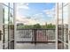 Scenic balcony view from home's doors showing rooftops and distant city at 2721 Curtis St, Denver, CO 80205