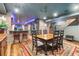 Basement with dining area, bar, and classic brick accents for a welcoming entertainment space at 2721 Curtis St, Denver, CO 80205