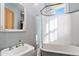 Charming bathroom features a clawfoot tub, pedestal sink, and ornate mirror at 2721 Curtis St, Denver, CO 80205