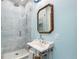 Beautiful bathroom with a glass enclosed shower and modern fixtures at 2721 Curtis St, Denver, CO 80205