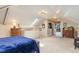 Spacious bedroom featuring a skylight, neutral walls, and plush carpeting at 2721 Curtis St, Denver, CO 80205