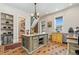 Bright kitchen with a center island, stylish cabinetry, and modern appliances creates a functional and appealing space at 2721 Curtis St, Denver, CO 80205