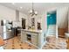 Well-equipped kitchen with stainless steel appliances, a center island, and ample storage, perfect for cooking at 2721 Curtis St, Denver, CO 80205