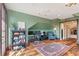 Home office features exposed beams, hardwood floors, and an inviting workspace at 2721 Curtis St, Denver, CO 80205