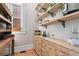 Well-organized pantry with open shelving, decorative accents, and ample storage space for kitchen essentials at 2721 Curtis St, Denver, CO 80205