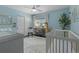 Light blue Bedroom with crib, chair, and storage at 7513 E Bates Dr, Denver, CO 80231