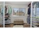 Spacious walk-in closet with ample shelving and hanging space at 7513 E Bates Dr, Denver, CO 80231