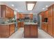 Updated kitchen, featuring granite countertops and wooden cabinets at 7513 E Bates Dr, Denver, CO 80231