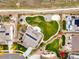 Aerial view of a home with a vast backyard, including a playground, garden, and patio area for outdoor living at 2258 Front Range Rd, Erie, CO 80516