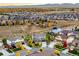 Drone view of a home in a neighborhood with mature trees and landscaping at 2258 Front Range Rd, Erie, CO 80516