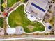 Aerial view of the property features a well maintained lawn, outdoor seating area, and mature landscaping at 2258 Front Range Rd, Erie, CO 80516