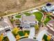 Aerial view showcasing the home's backyard with lush lawn, garden area, and playground at 2258 Front Range Rd, Erie, CO 80516