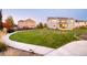 Expansive backyard features lush lawn, colorful landscaping and an outdoor patio perfect for entertaining at 2258 Front Range Rd, Erie, CO 80516