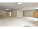 Vast finished basement area with carpet flooring, multiple rooms, and potential for customization at 2258 Front Range Rd, Erie, CO 80516