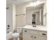 Bright bathroom with a white vanity, classic fixtures, and tiled shower/tub, offers a clean and functional design at 2258 Front Range Rd, Erie, CO 80516