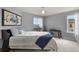Comfortable bedroom with large window, musical instruments, and a simple yet stylish decor at 2258 Front Range Rd, Erie, CO 80516