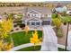 Beautiful two-story home with lush landscaping and a welcoming front porch at 2258 Front Range Rd, Erie, CO 80516