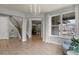 Spacious living room with hardwood floors and large windows offering plenty of natural light at 2258 Front Range Rd, Erie, CO 80516