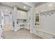 Functional mud room with built-in bench, shelving, cubbies, and desk with ample storage at 2258 Front Range Rd, Erie, CO 80516